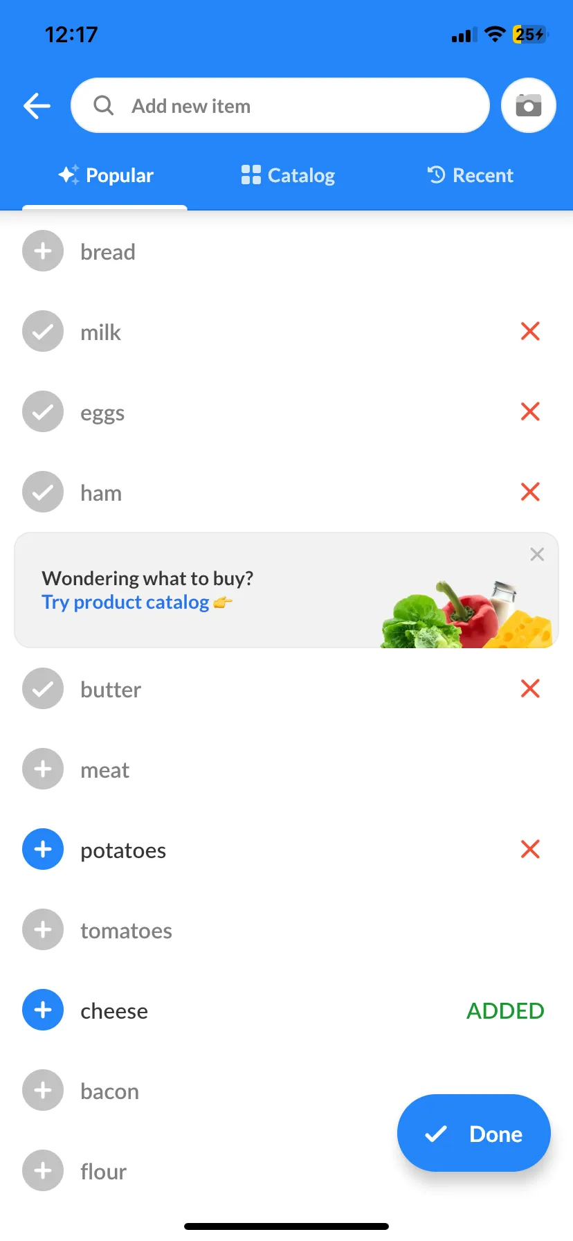 The same Listonic add-item screen part-way through a shop, with cheese marked ADDED, potatoes and butter ticked, and a Done button ready to close the sheet